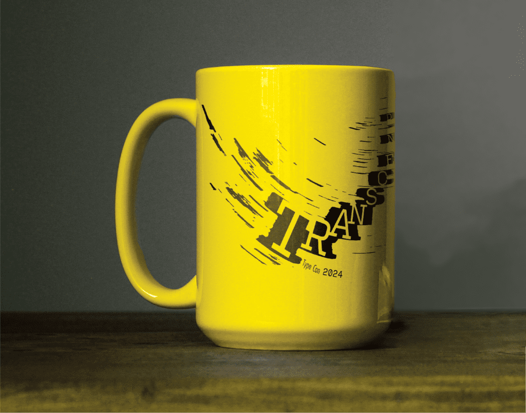 A yellow mug with the transcend logo on it